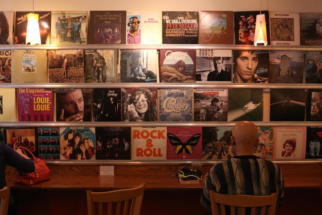 Caffe Amouri Album Wall community comes to listen to records